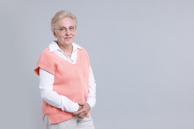 Photo of Portrait of senior woman on light background. Space for text