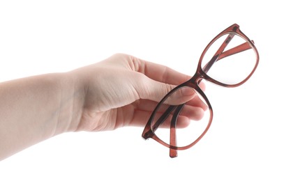 Photo of Woman holding glasses with brown frame on white background, closeup