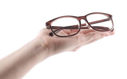 Photo of Woman holding glasses with brown frame on white background, closeup