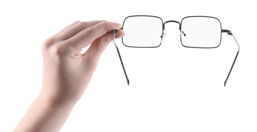 Photo of Woman holding glasses with black metal frame on white background, closeup