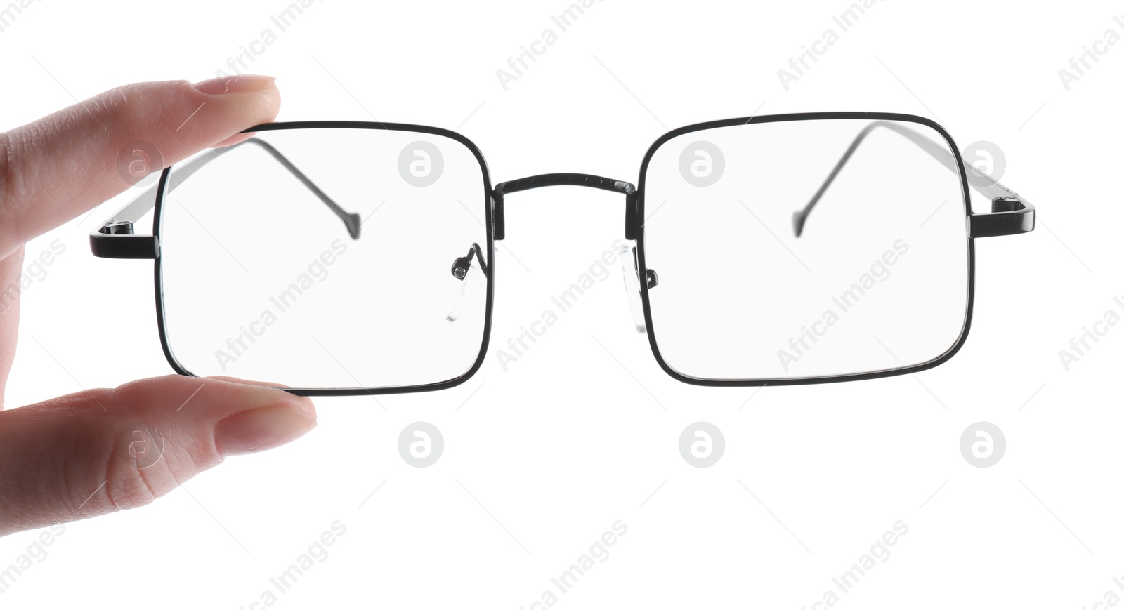 Photo of Woman holding glasses with black metal frame on white background, closeup