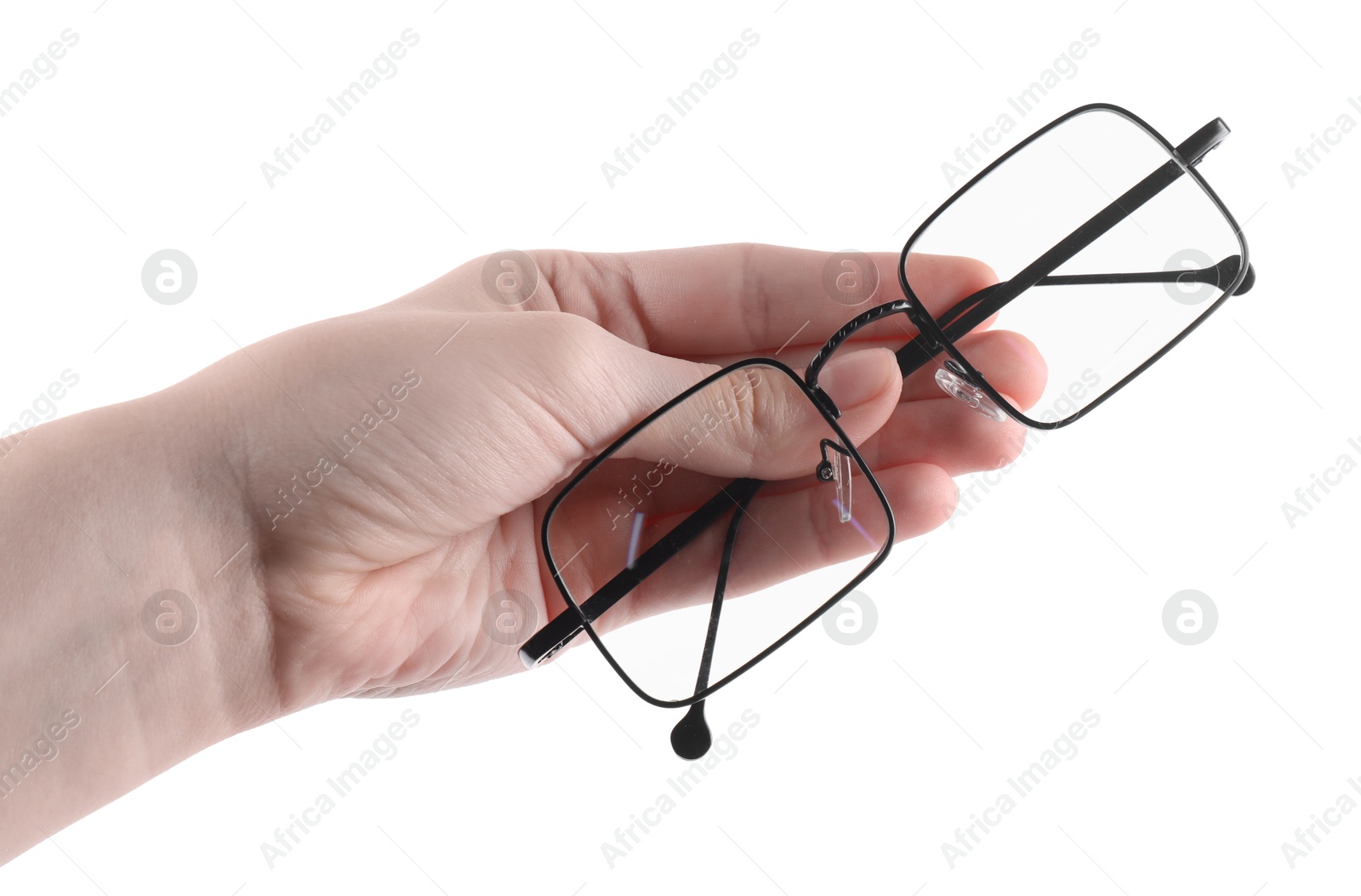 Photo of Woman holding glasses with black metal frame on white background, closeup