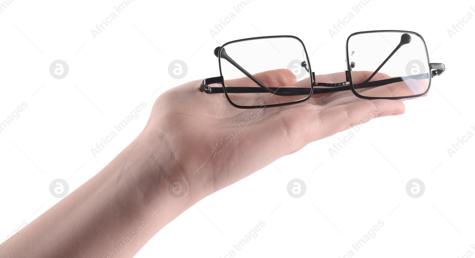 Photo of Woman holding glasses with black metal frame on white background, closeup