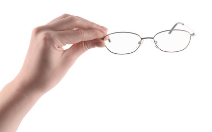 Photo of Woman holding glasses with round metal frame on white background, closeup