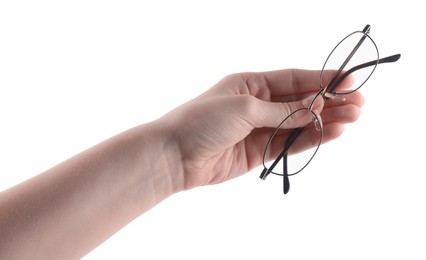 Photo of Woman holding glasses with round metal frame on white background, closeup