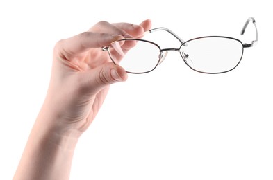 Photo of Woman holding glasses with round metal frame on white background, closeup