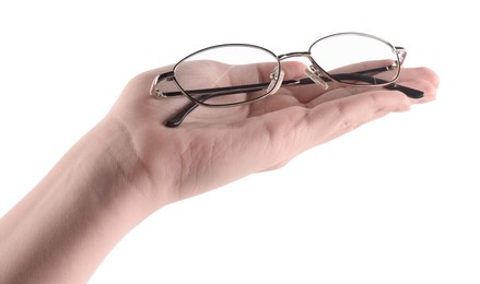 Photo of Woman holding glasses with round metal frame on white background, closeup