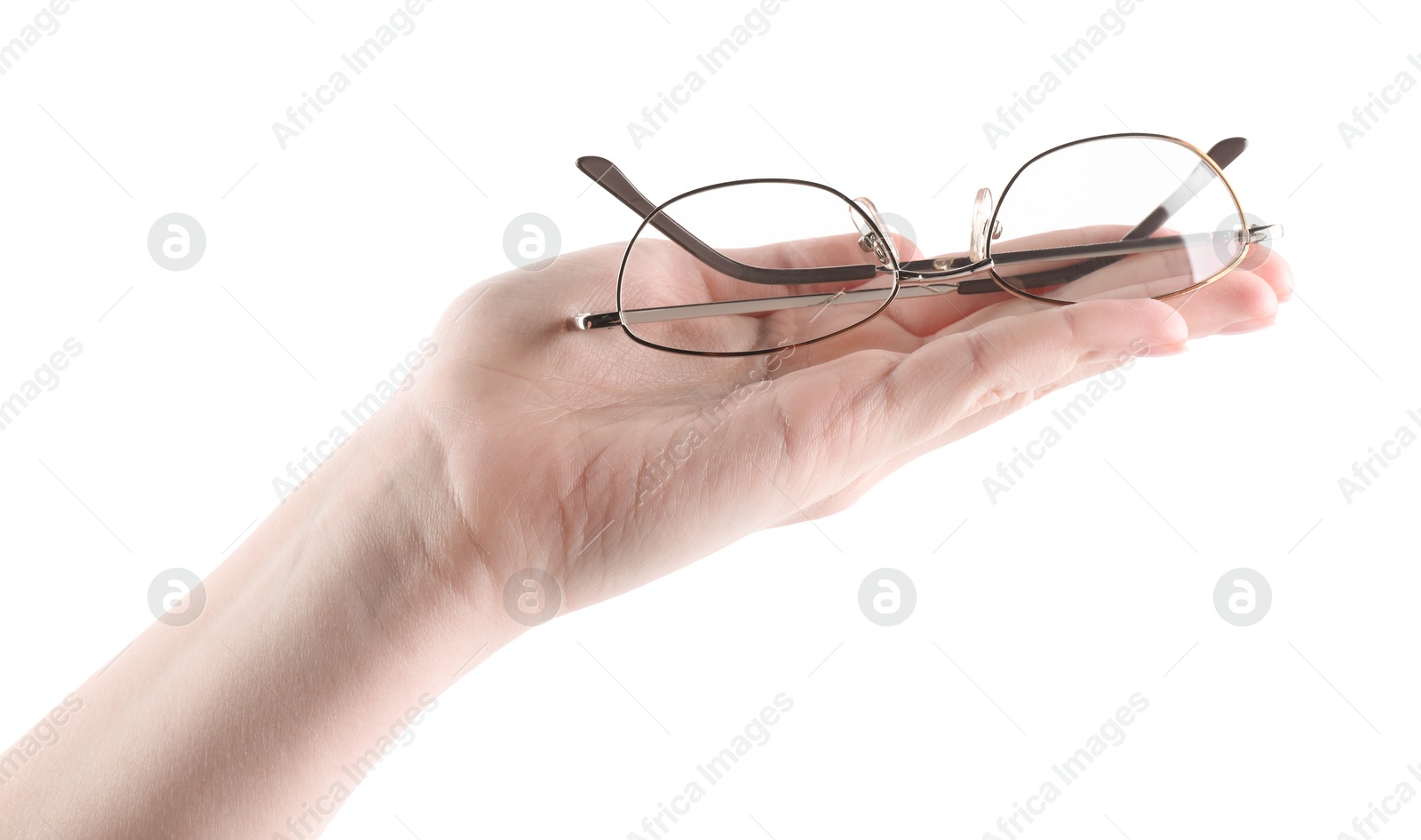 Woman holding glasses with round metal frame on white background, closeup Photo of Woman holding glasses with round metal frame on white background, closeup