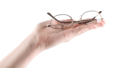 Photo of Woman holding glasses with round metal frame on white background, closeup