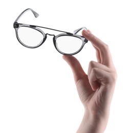 Photo of Woman holding glasses with stylish frame on white background, closeup