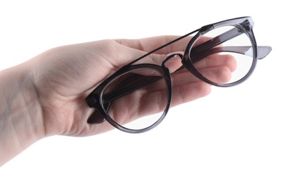 Photo of Woman holding glasses with stylish frame on white background, closeup