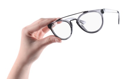 Photo of Woman holding glasses with stylish frame on white background, closeup