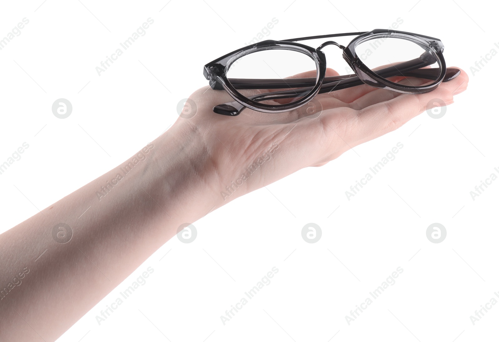 Photo of Woman holding glasses with stylish frame on white background, closeup