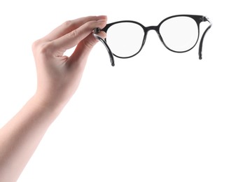 Photo of Woman holding glasses with trendy black frame on white background, closeup