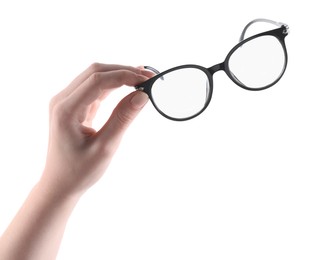 Photo of Woman holding glasses with trendy black frame on white background, closeup