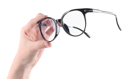 Photo of Woman holding glasses with trendy black frame on white background, closeup