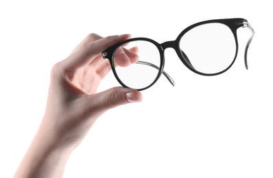 Photo of Woman holding glasses with trendy black frame on white background, closeup