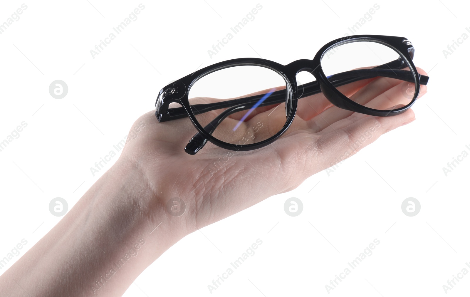 Photo of Woman holding glasses with trendy black frame on white background, closeup