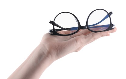 Photo of Woman holding glasses with trendy black frame on white background, closeup