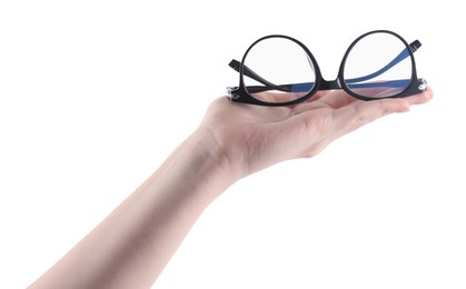 Photo of Woman holding glasses with trendy black frame on white background, closeup