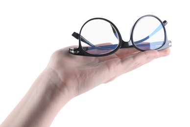 Photo of Woman holding glasses with trendy black frame on white background, closeup