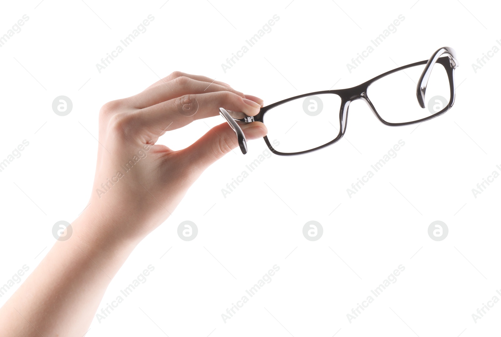 Photo of Woman holding glasses with black plastic frame on white background, closeup