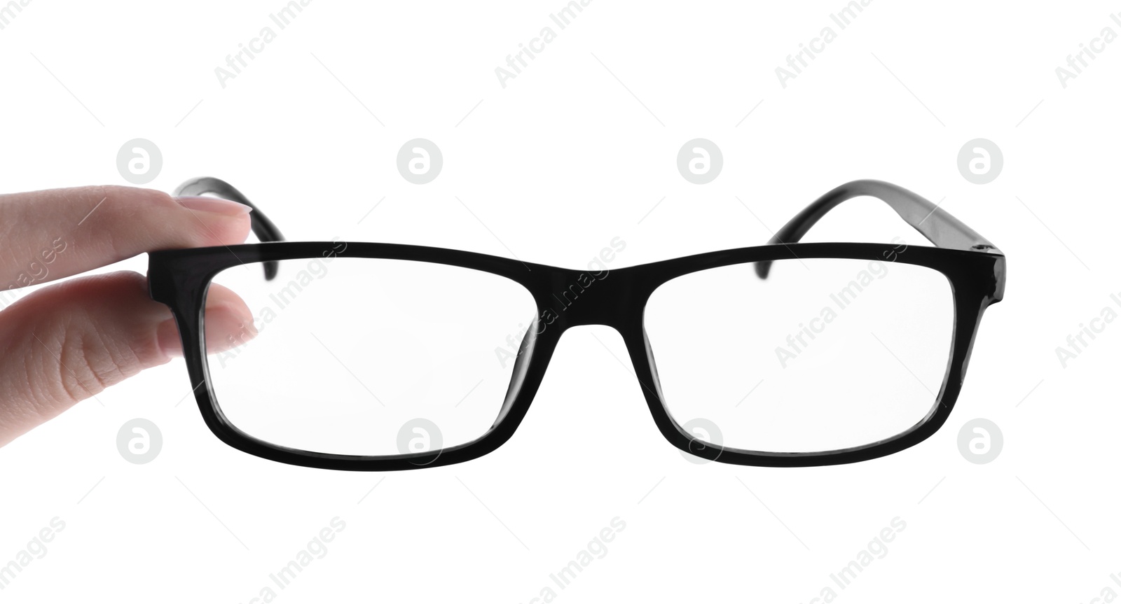 Photo of Woman holding glasses with black plastic frame on white background, closeup