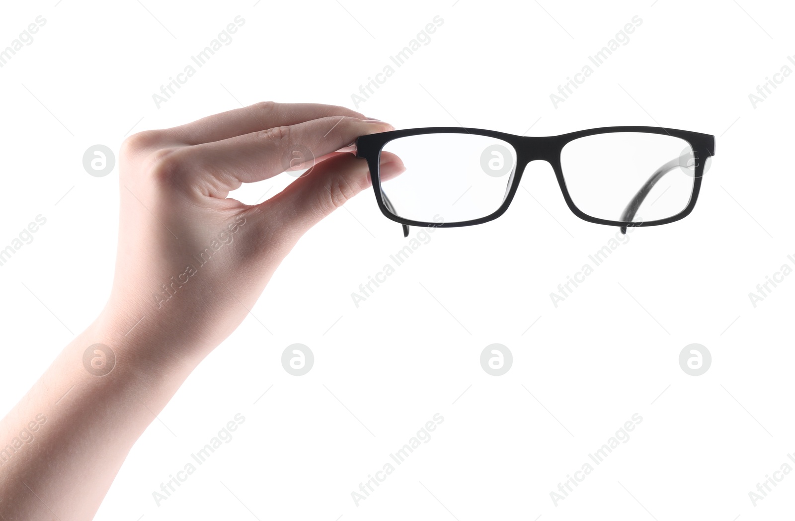 Photo of Woman holding glasses with black plastic frame on white background, closeup