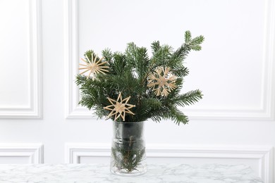 Photo of Beautiful decorated fir tree branches on white table. Christmas season