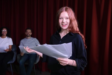 Professional actress rehearsing on stage in theatre