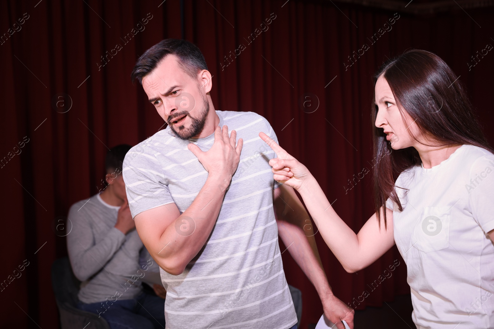 Photo of Professional actors rehearsing on stage in theatre