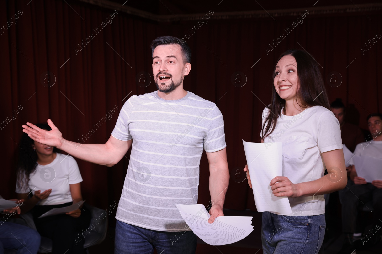 Photo of Professional actors rehearsing on stage in theatre