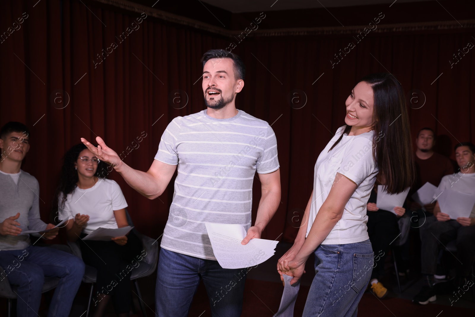 Photo of Professional actors rehearsing on stage in theatre