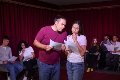 Photo of Professional actors rehearsing on stage in theatre