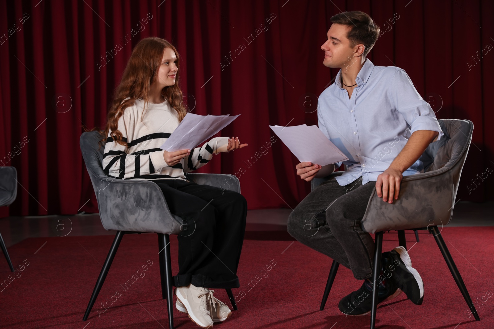 Photo of Professional actors rehearsing on stage in theatre