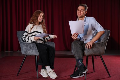 Photo of Professional actors rehearsing on stage in theatre