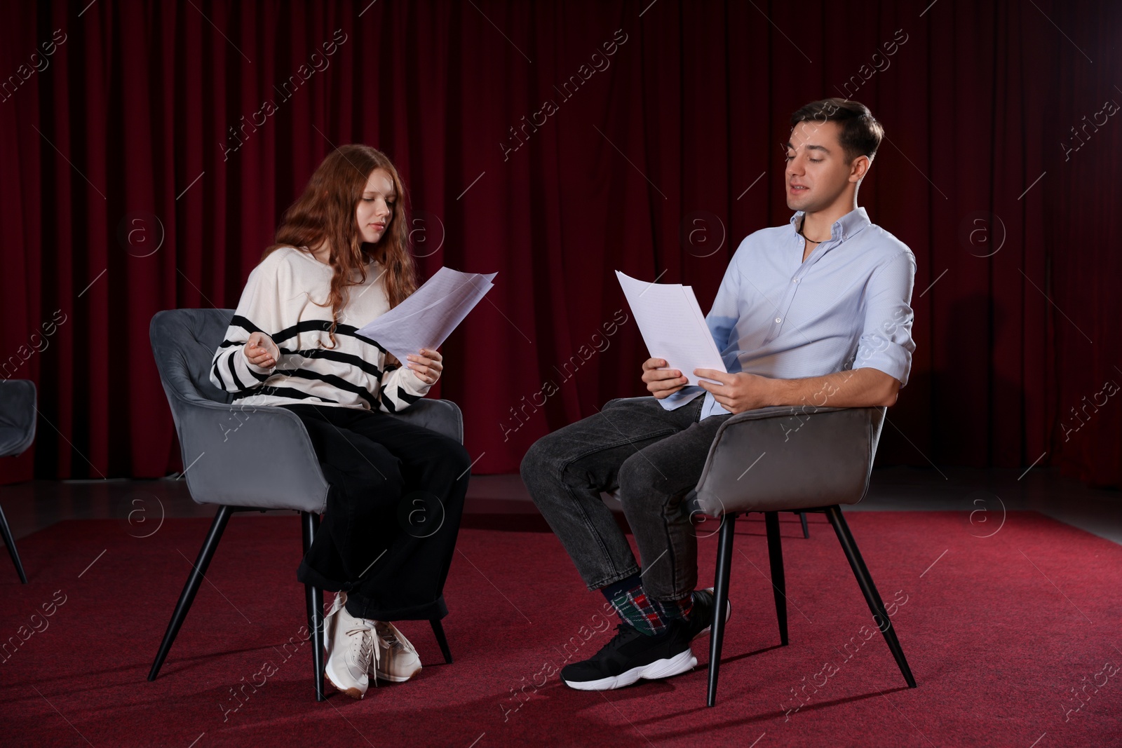 Photo of Professional actors rehearsing on stage in theatre