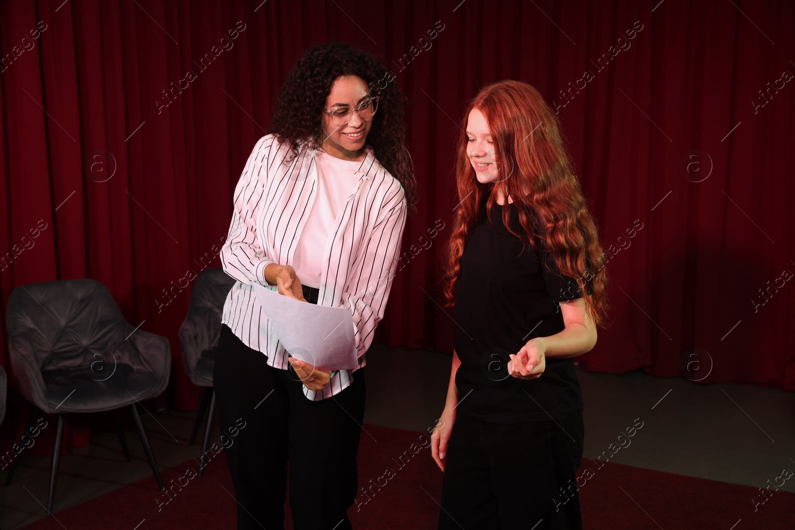 Photo of Professional actors rehearsing on stage in theatre