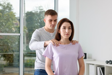 Osteopath working with patient in clinic. Manual therapy