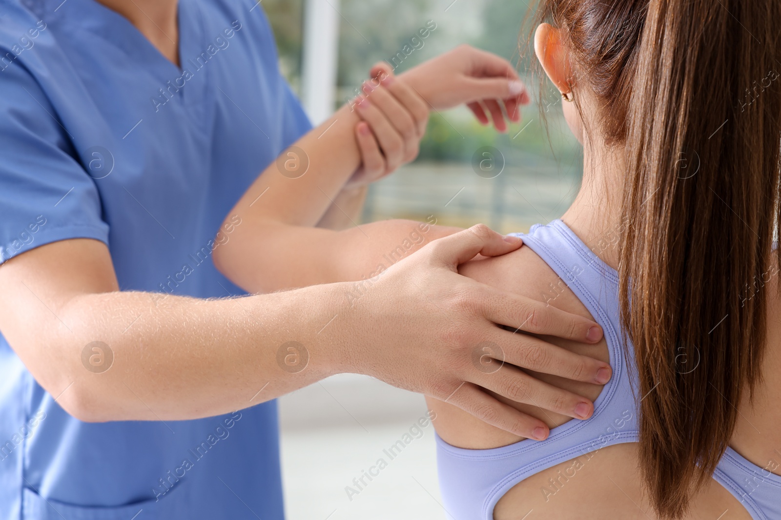 Photo of Osteopath working with patient in clinic, closeup. Manual therapy