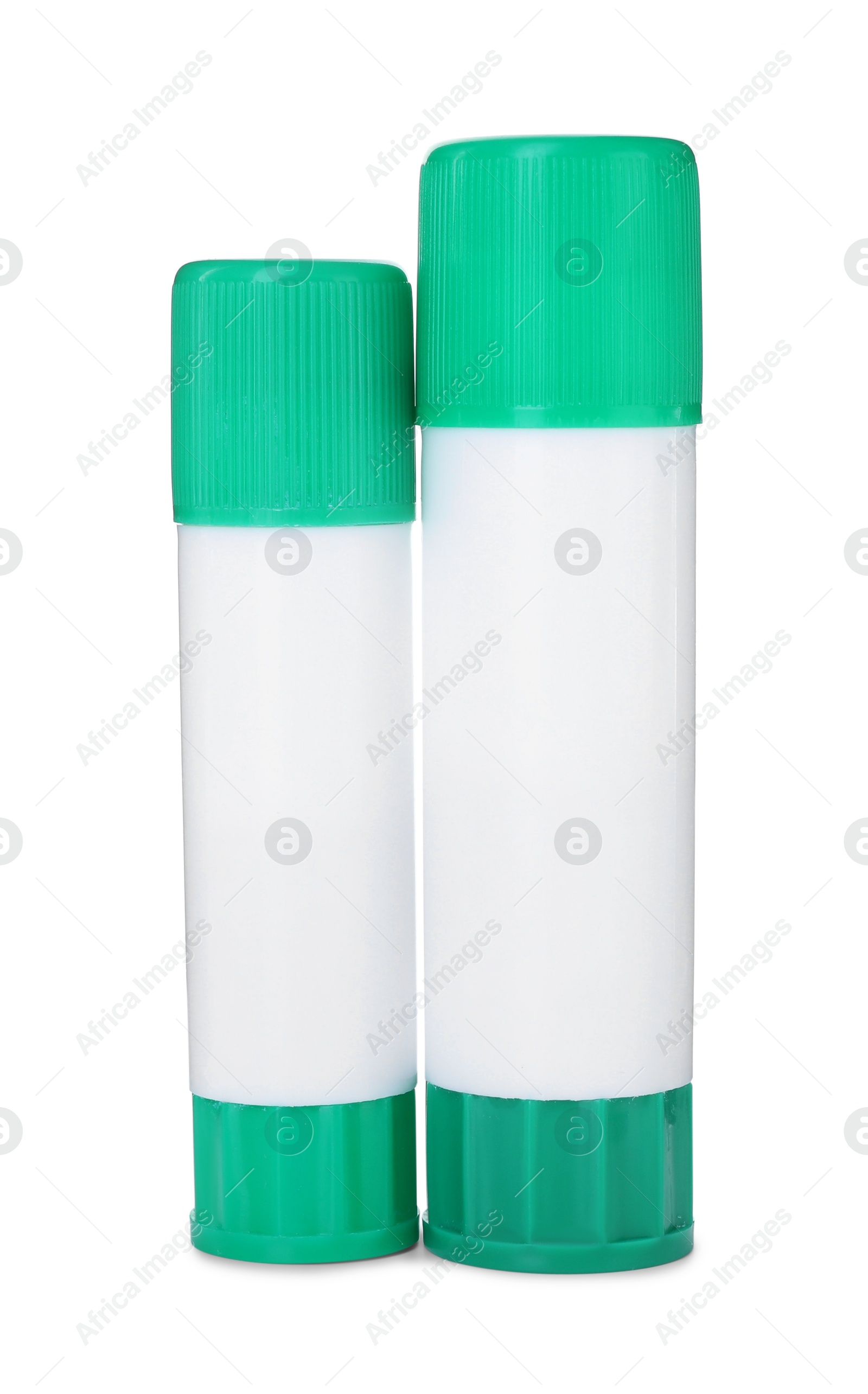 Photo of Two glue sticks with caps isolated on white