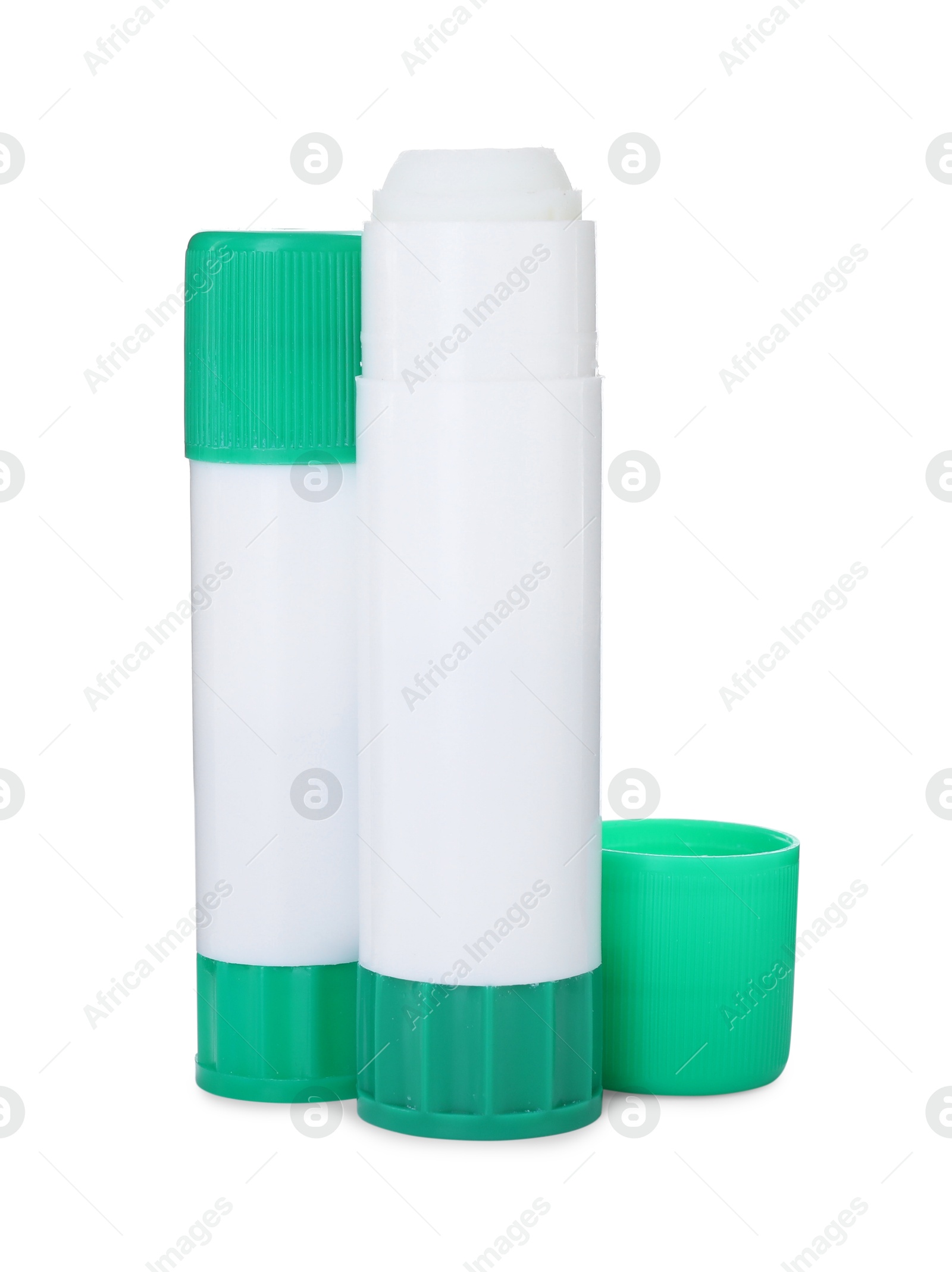 Photo of Two glue sticks with caps isolated on white