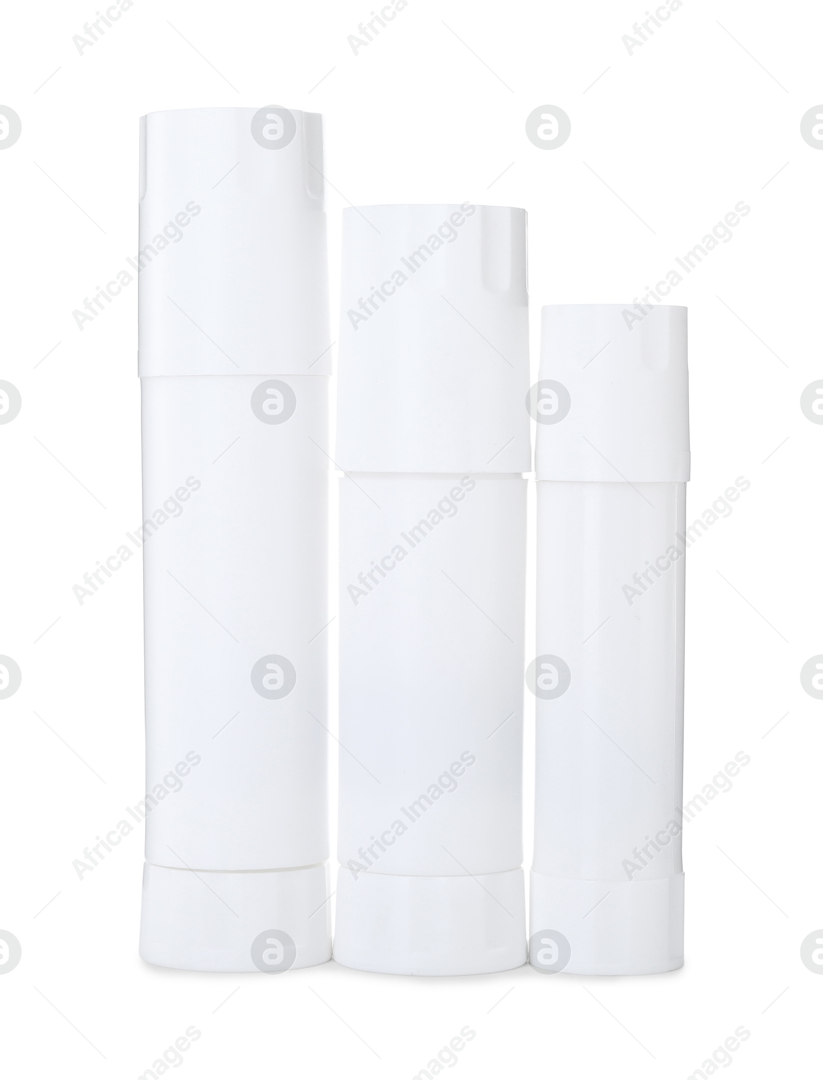 Photo of Many different glue sticks isolated on white