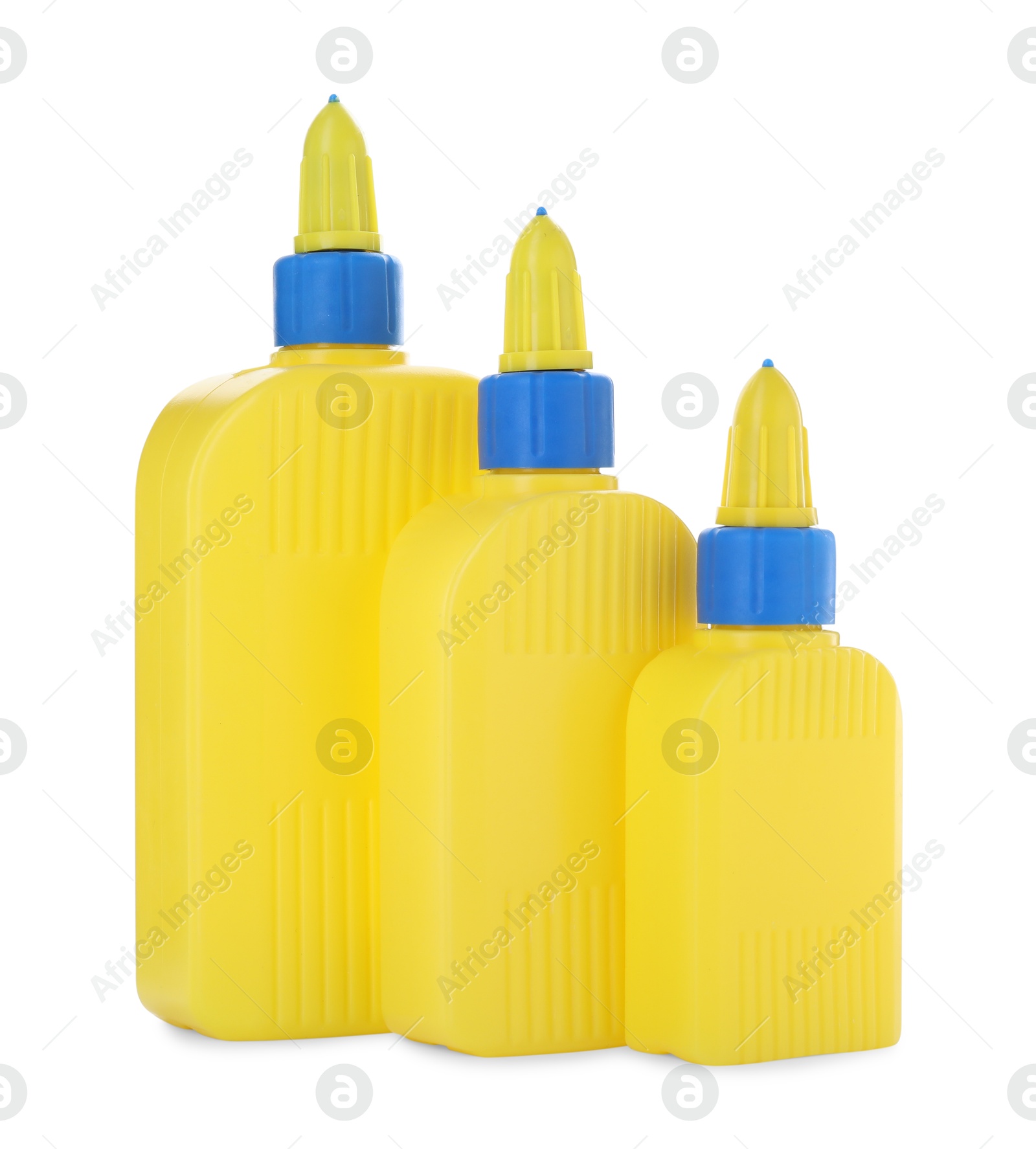 Photo of Bottles of glue with caps isolated on white