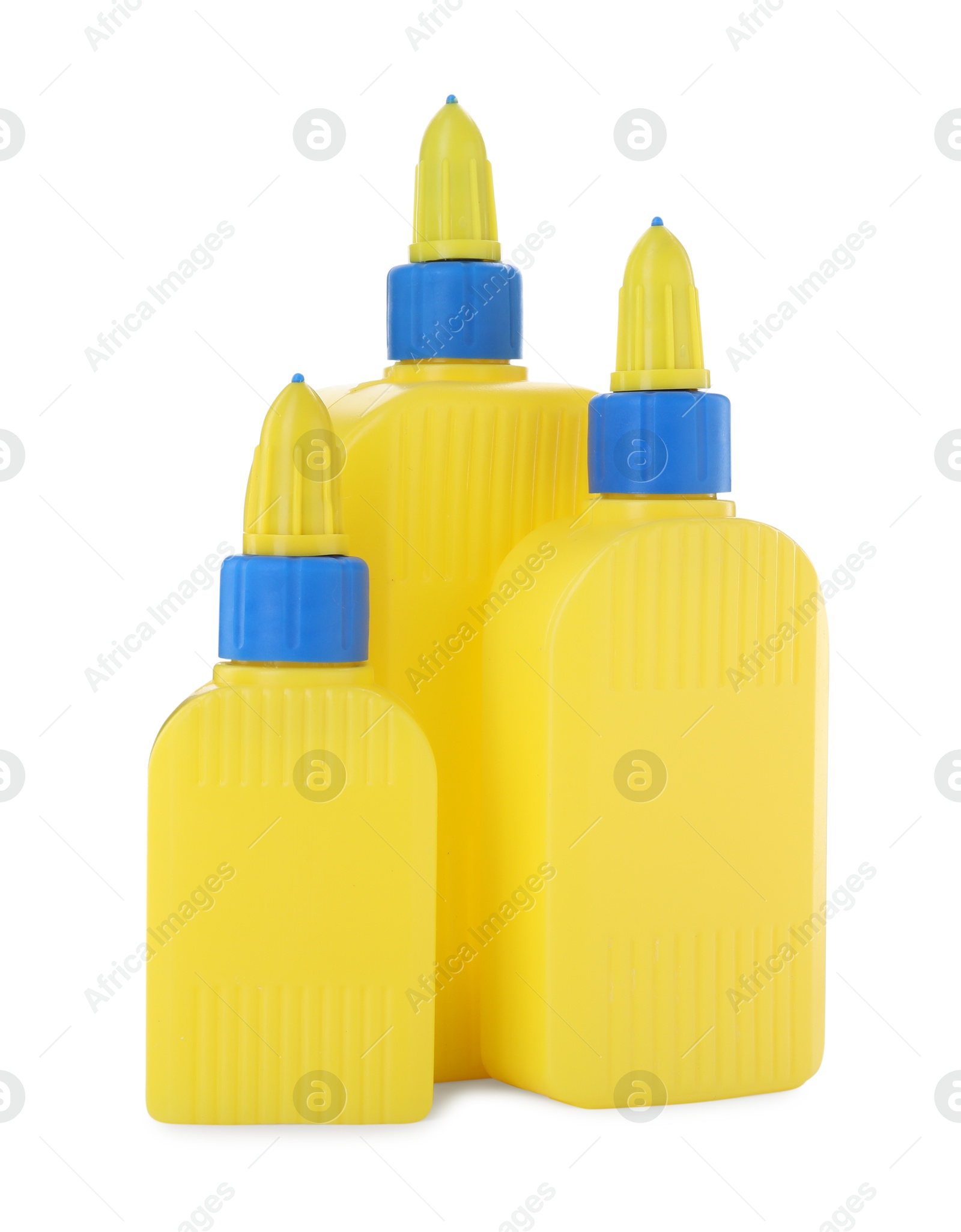 Photo of Bottles of glue with caps isolated on white