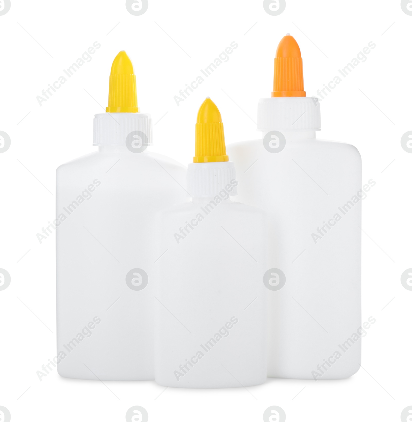 Photo of Bottles of glue with caps isolated on white