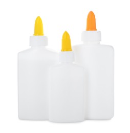 Photo of Bottles of glue with caps isolated on white