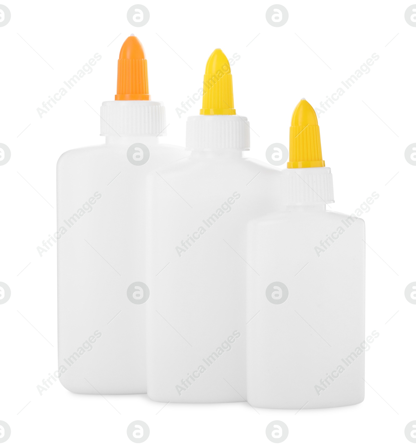 Photo of Bottles of glue with caps isolated on white