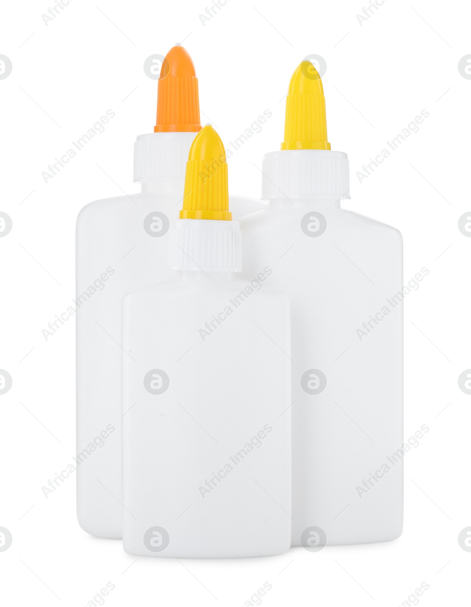 Photo of Bottles of glue with caps isolated on white