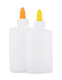 Photo of Bottles of glue with caps isolated on white